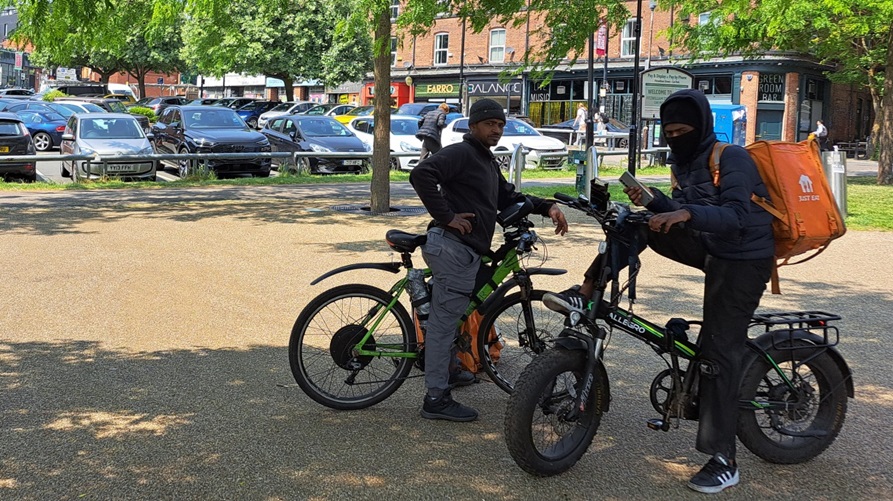 Food delivery drivers using e-bikes in Sheffield city centre