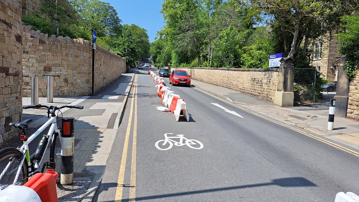 Road converted to be one way for car traffic and the introducation of a dedicated cycle carridgeway