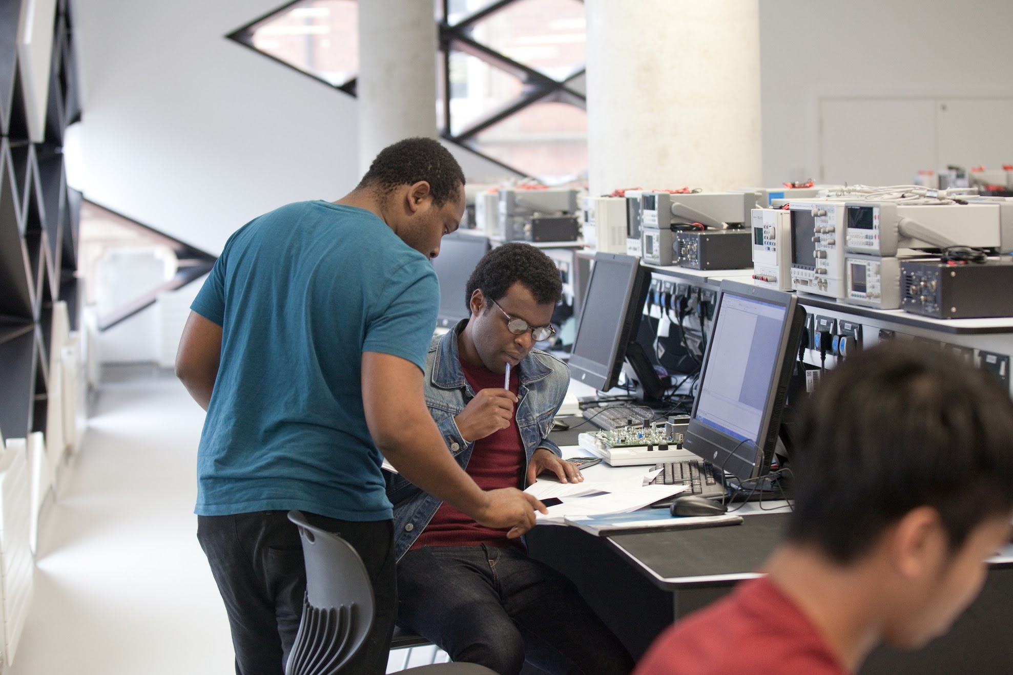 Students working together in the Electronics and Control lab in the Diamond