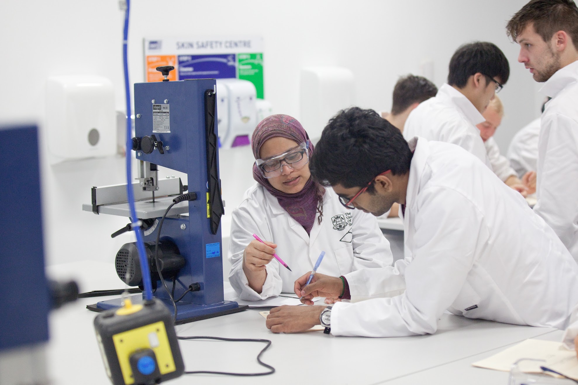 Engineering students conducting an experiment in the lab