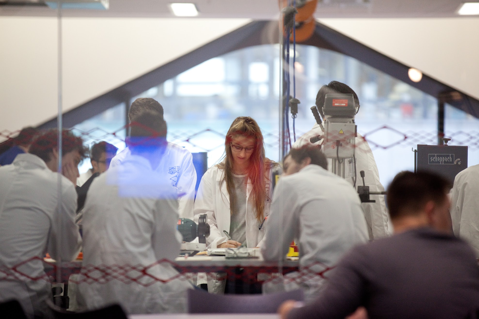 Students have a discussion in a lab