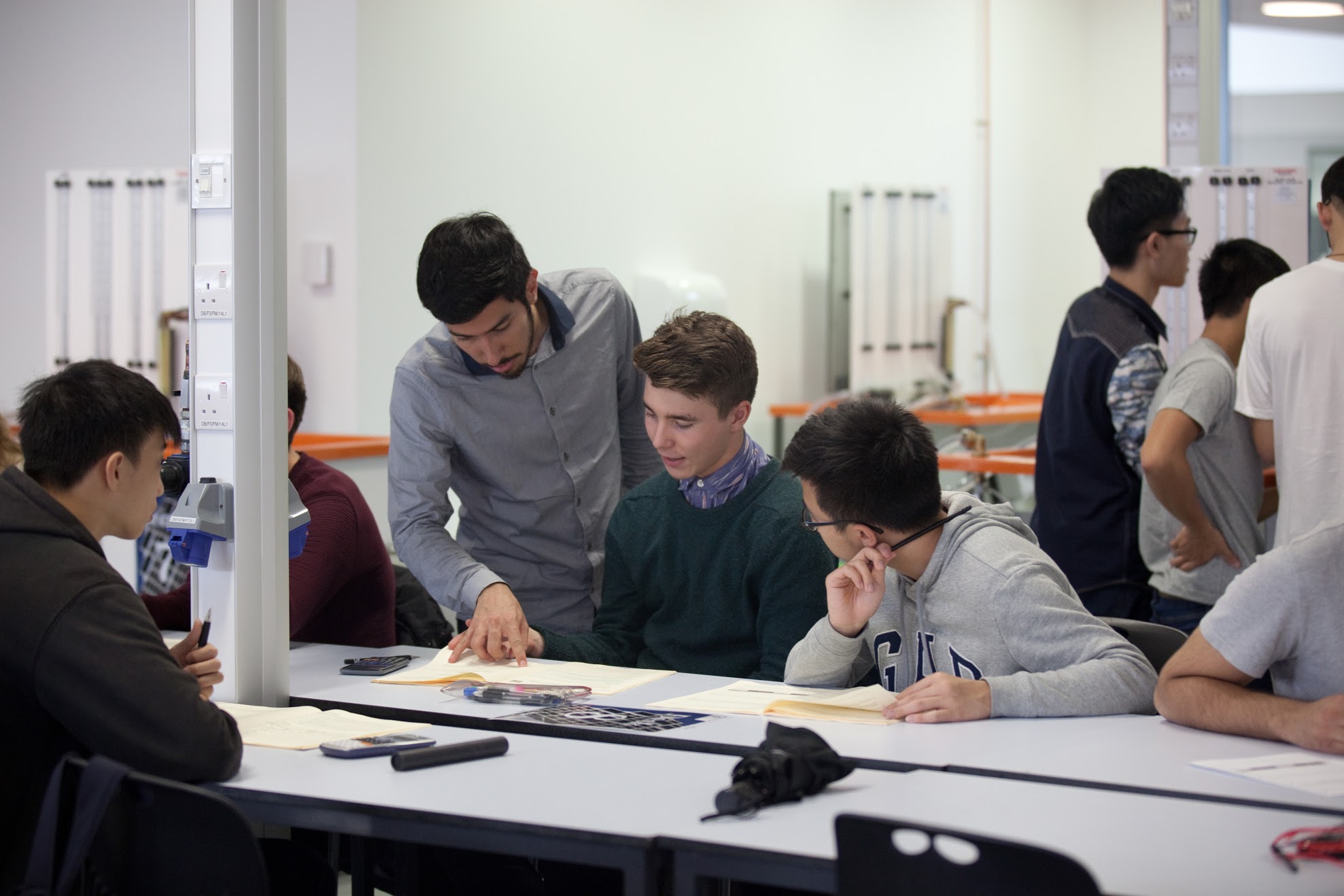 Students work through a lab book in class