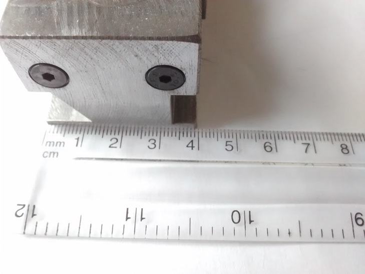 A component with a ruler measuring a distance of around 4 cm