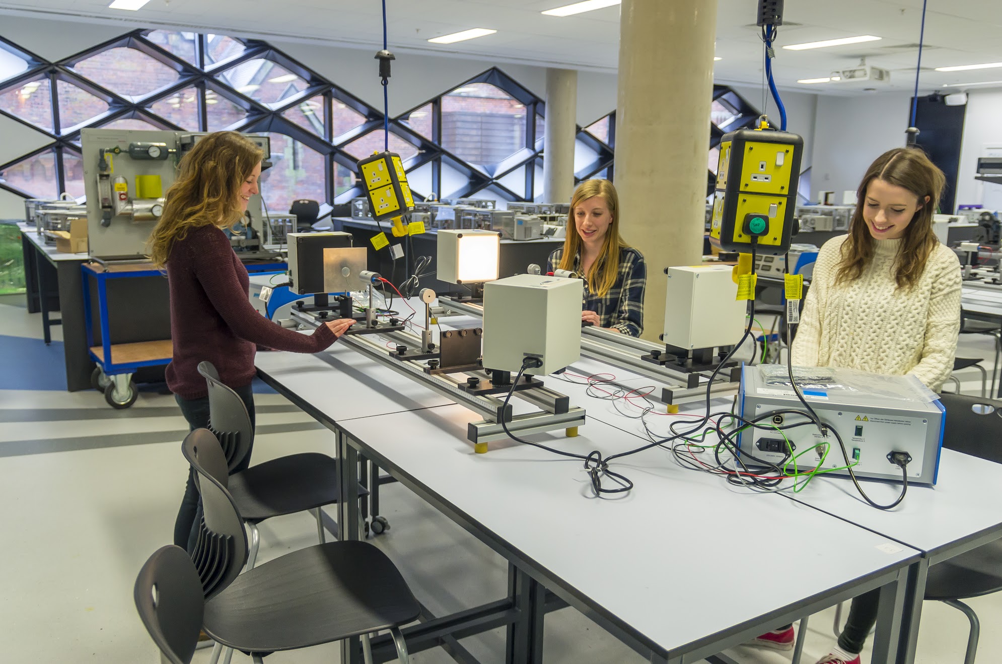 Students test equipment in the workshop